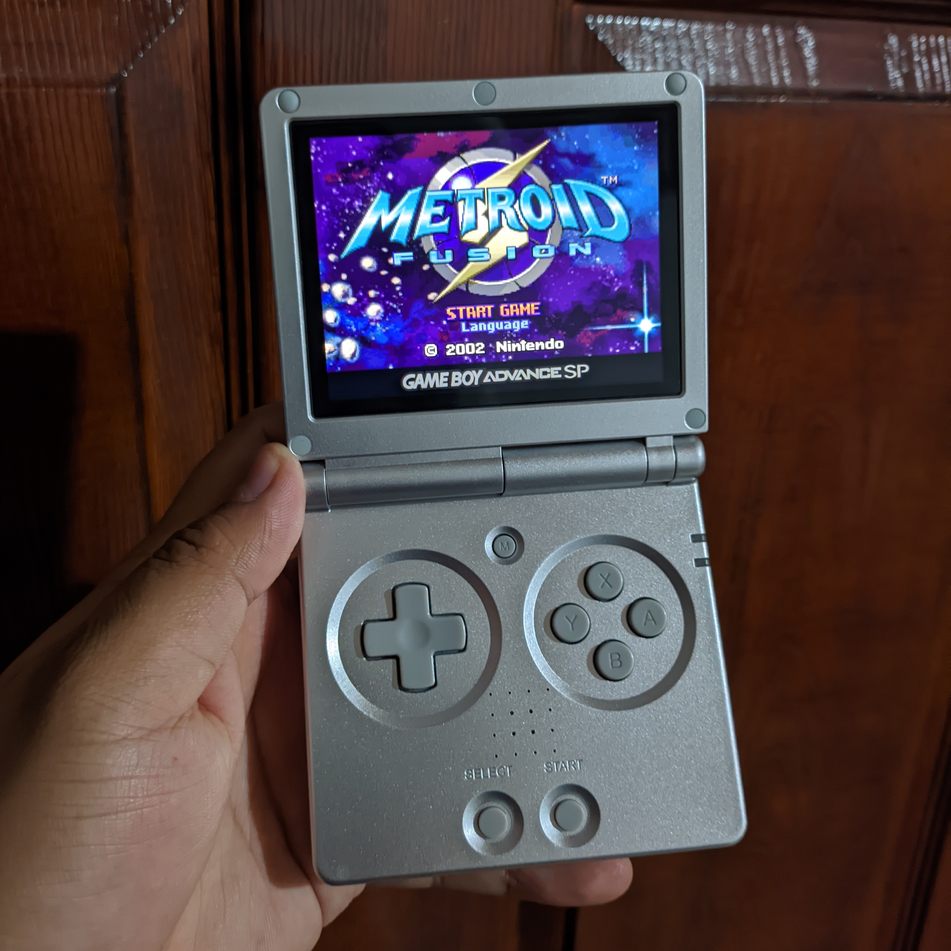 The RG35XX SP in all its glory, Metroid Fusion was the first game I beat on it