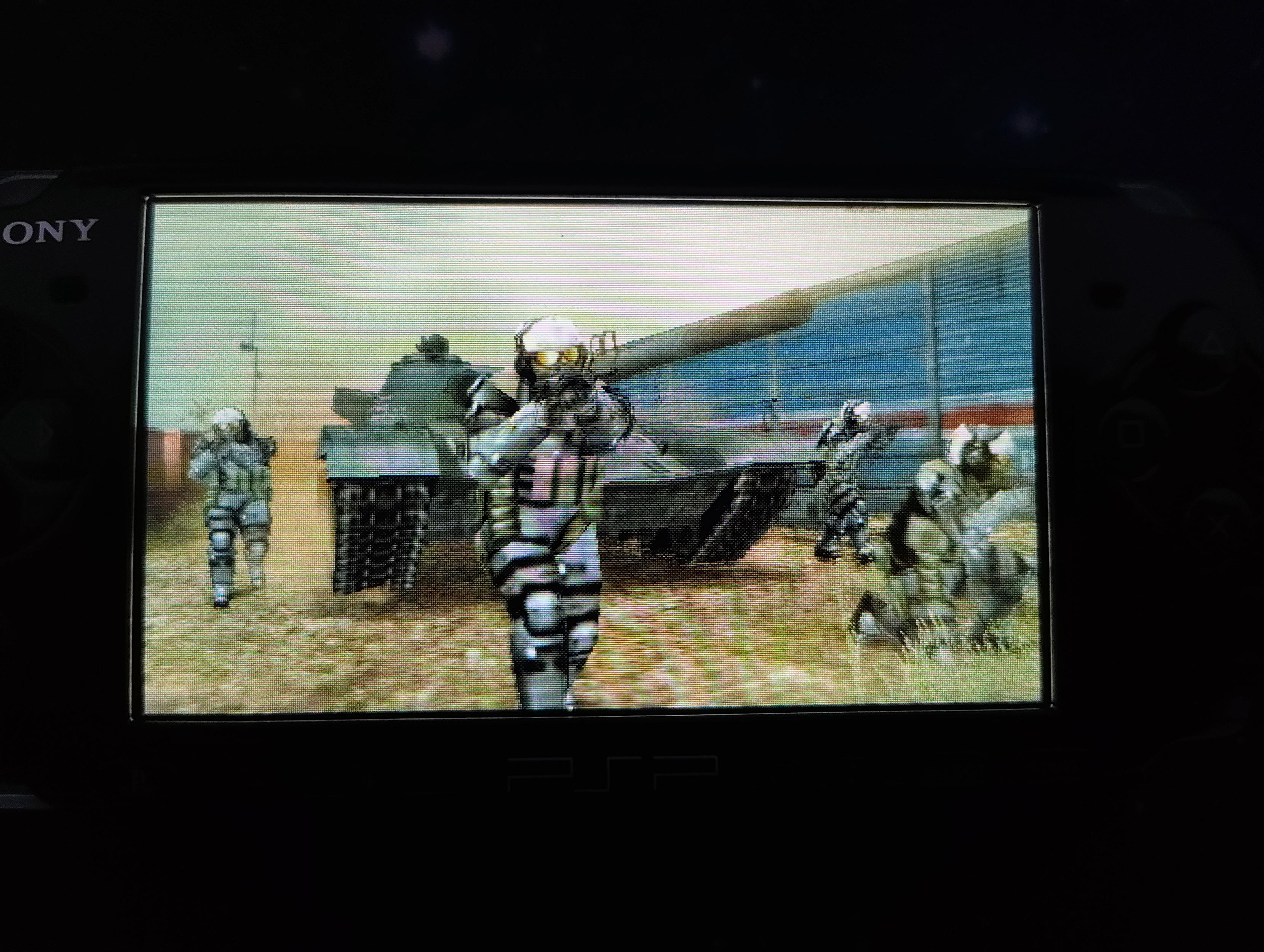 Some soldiers surrounding a tank, a boss fight for Snake to defeat!